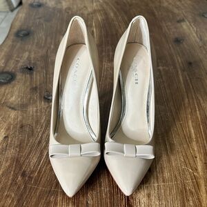 Coach Nude Patent Leather Pointed Toe Pumps with Bow